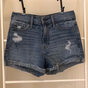 High waisted distressed blue jean shorts